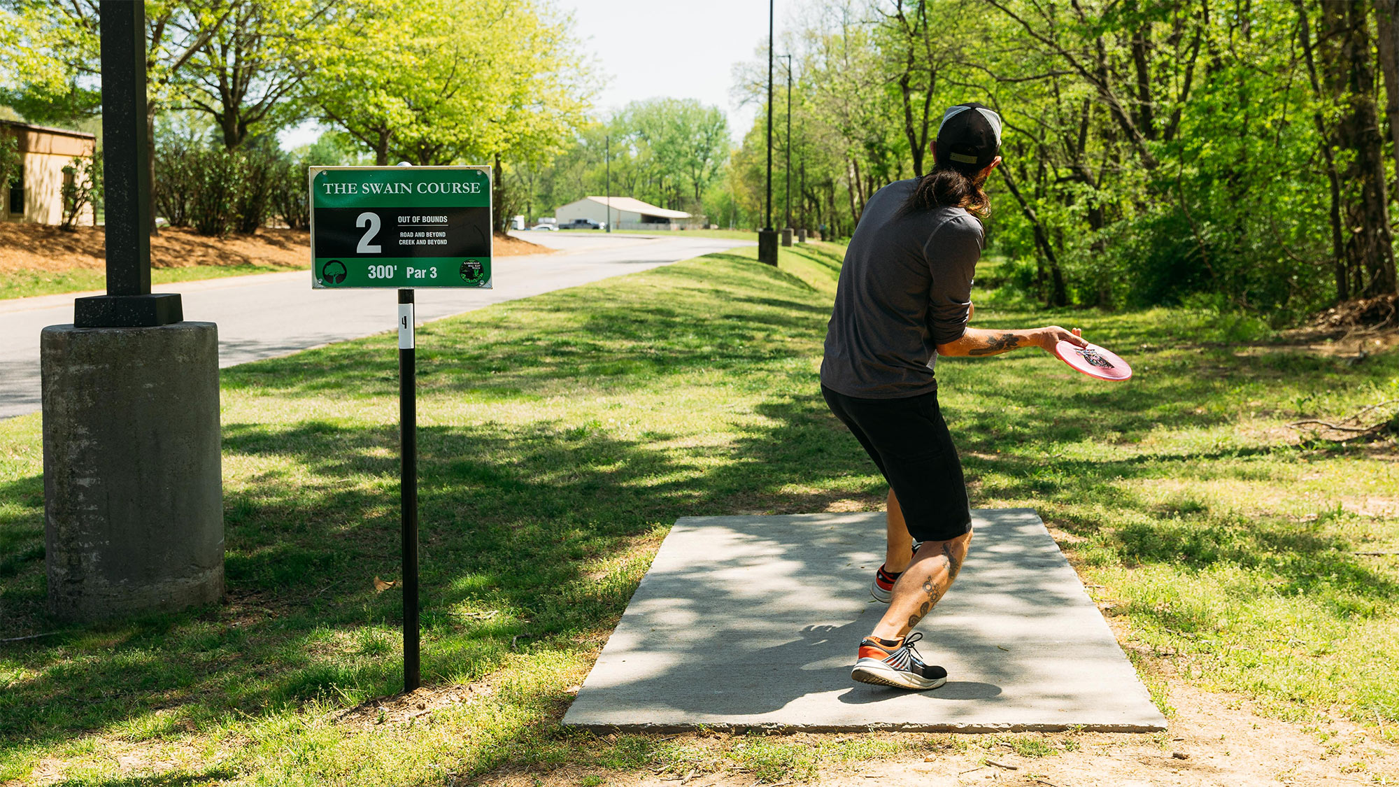 A guest enjoying the Swain Disc Golf Course