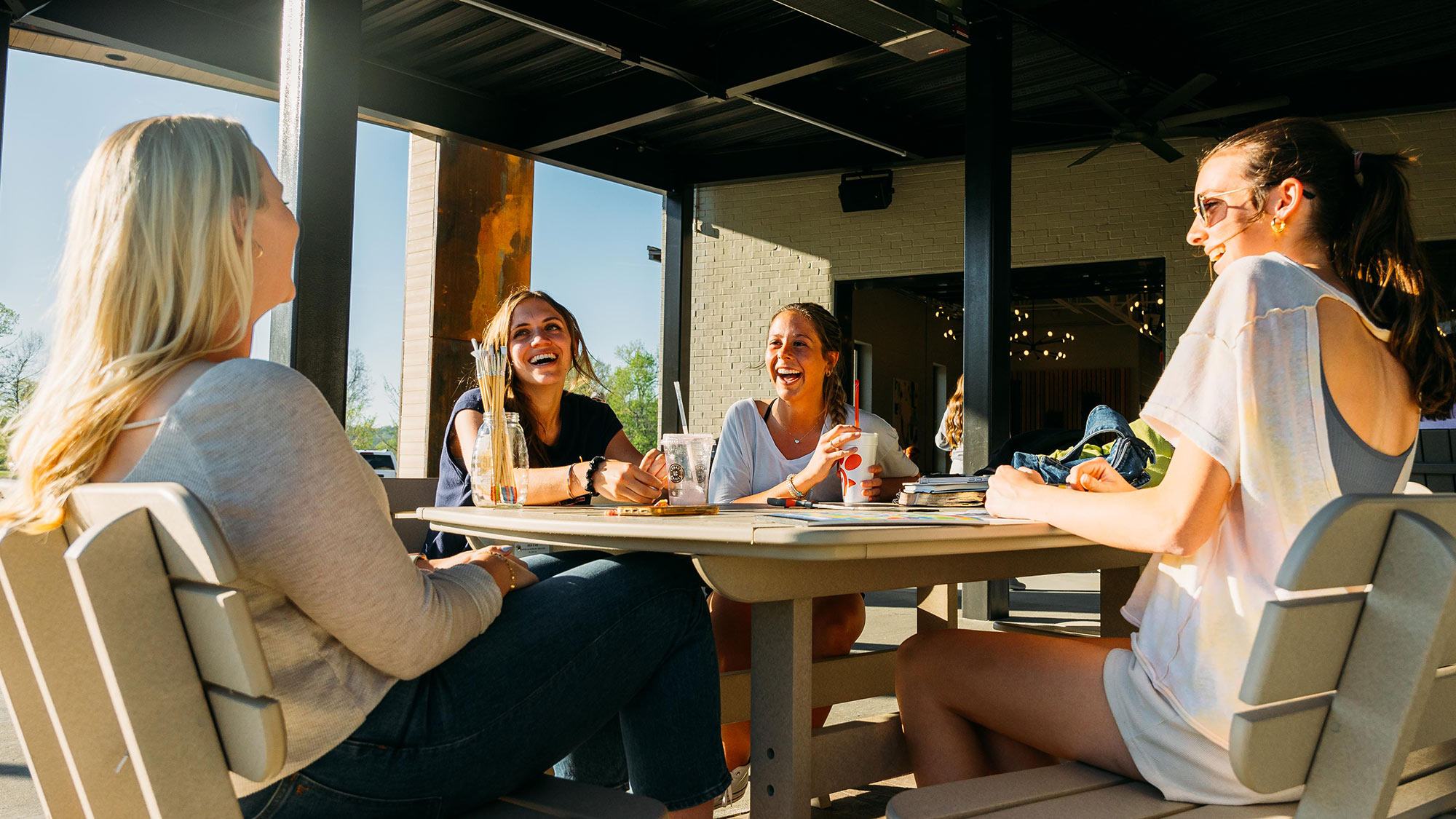 Young women enjoying the Legacy Park Patio